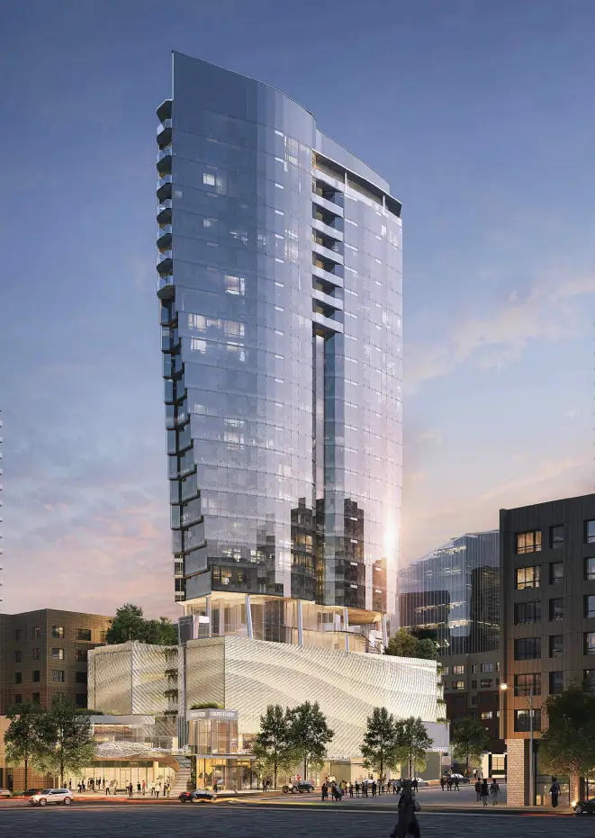 Rendering of the maru tower at dusk, its sail-shaped glass form rising above an undulating white podium